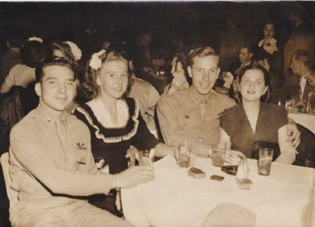 John and his wife ( right side ) celebrate after he returns to States